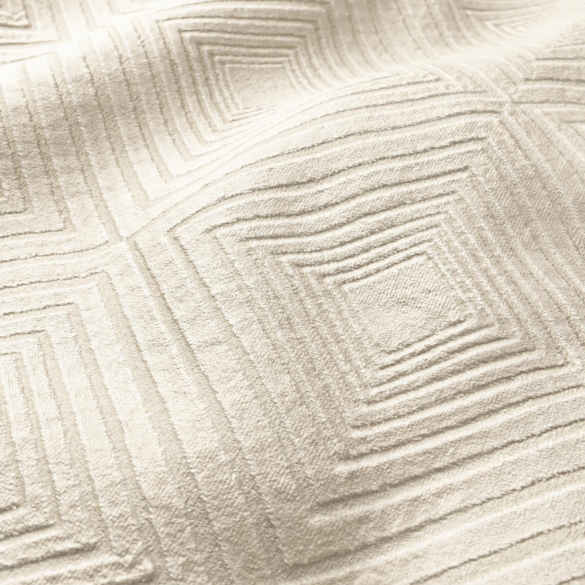 Beige plush velvet fabric with a raised geometric diamond pattern.
