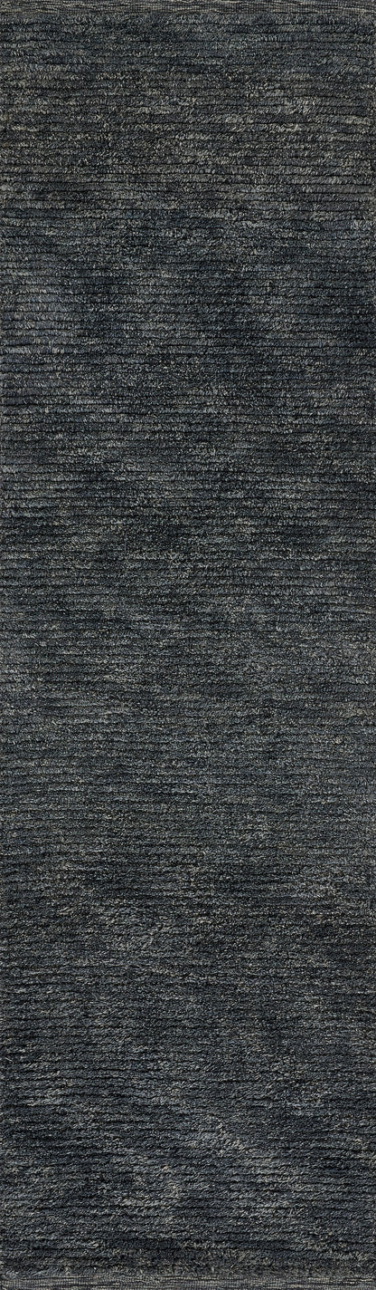 Dark charcoal textured plush fabric close-up with ribbed velvet-like pile, ideal for upholstery or rugs.