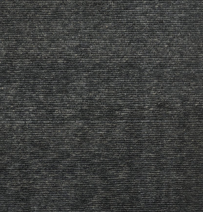 Charcoal gray ribbed fabric texture with horizontal lines; plush upholstery or rug material, soft and cozy.