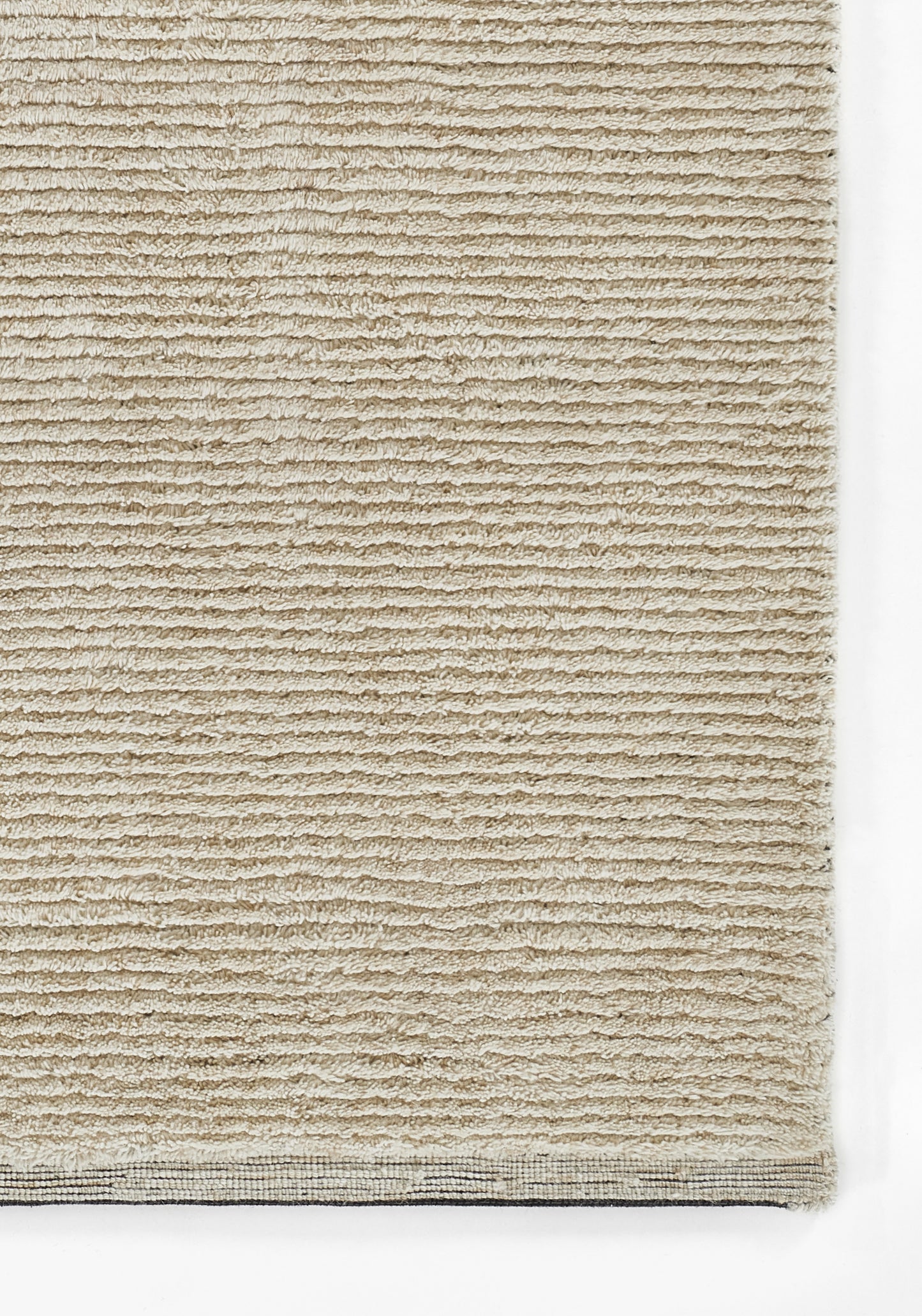 Beige loop-pile rug with ribbed texture and woven border, rectangular floor covering for living spaces.