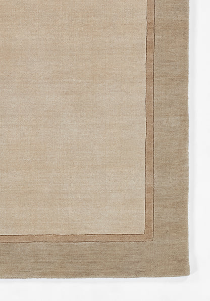 Beige taupe flat-weave rug with a darker brown framed border and linen texture.