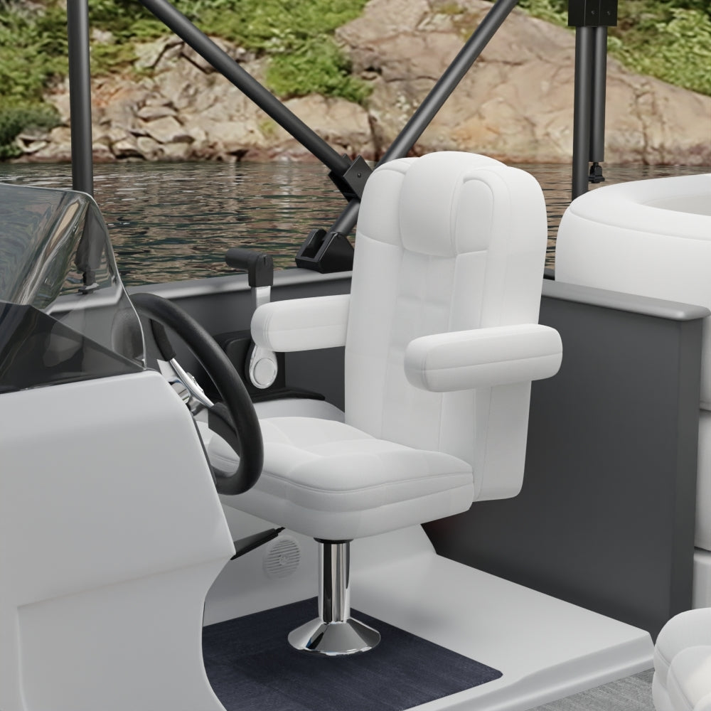 White captain chair with padded armrests on a chrome pedestal in a gray & white boat cockpit, water and shore behind.