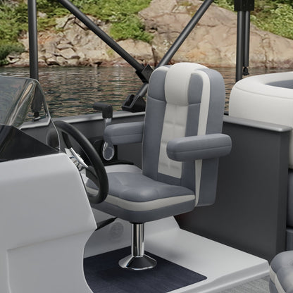 Gray solid fabric captain chair with padded armrests on a pedestal in a boat cockpit.