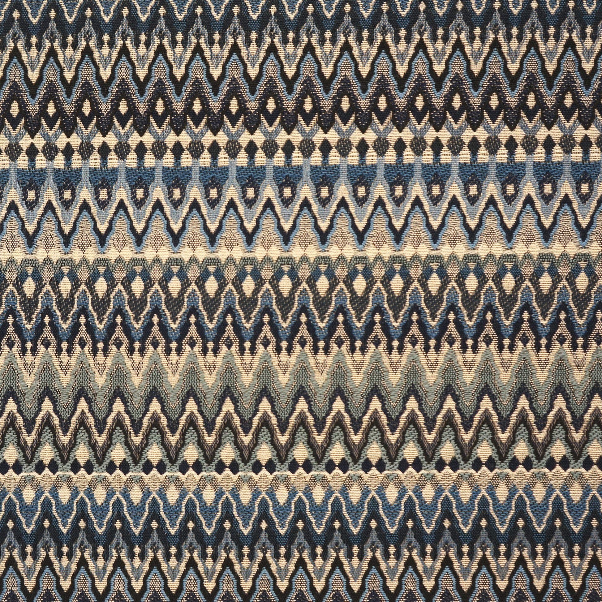 Blue and beige chevron zigzag woven fabric with horizontal stripe bands.