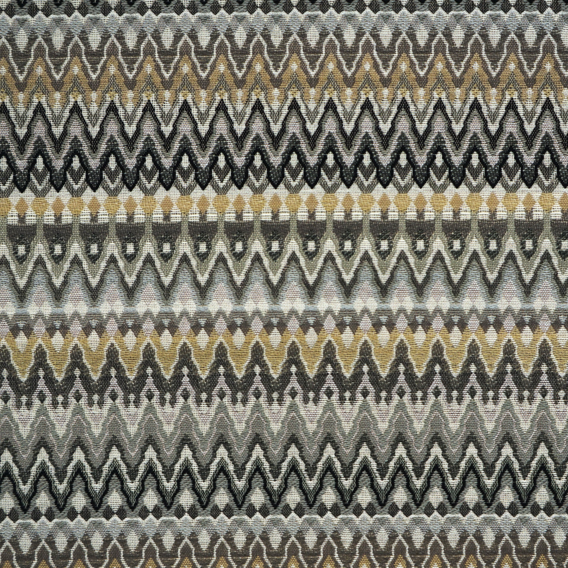 Chevron zigzag woven fabric in gray, black, beige and gold tones; repeating bands across the fabric.