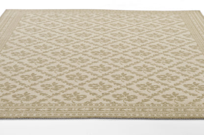 Beige woven area rug with a tonal floral lattice pattern and decorative border.