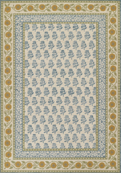 Area rug with ivory field blue floral motifs bordered by blue scroll band tan border with orange medallions and vines.
