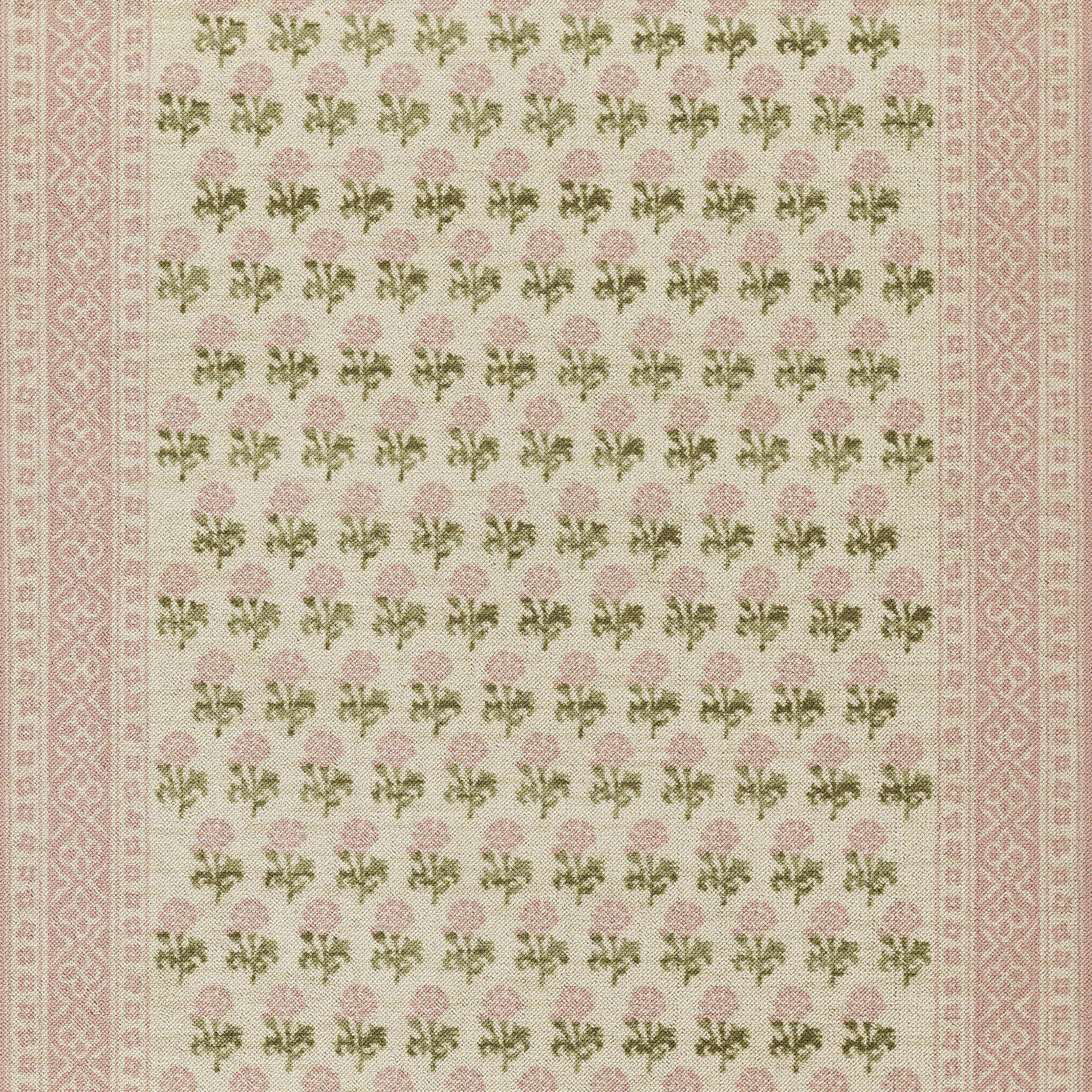 Cream rug with pink patterned borders and a dense repeating floral design of pink roses and green leaves.