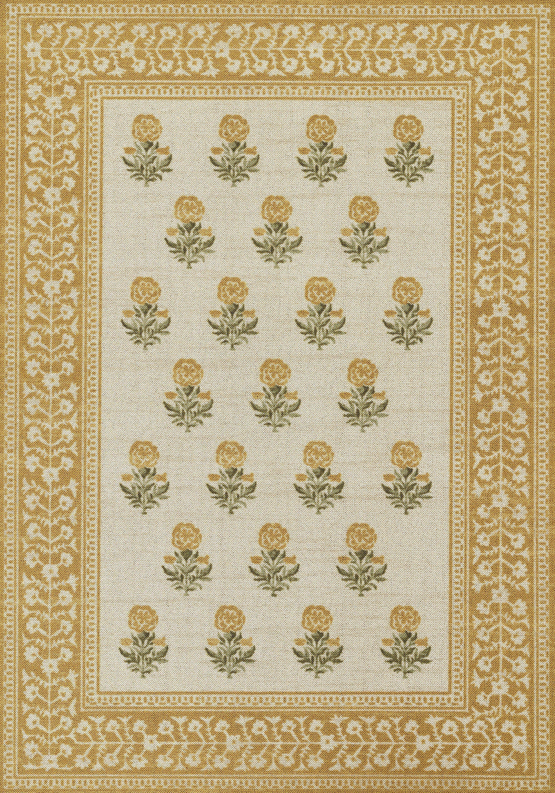 Rectangular area rug with cream field, repeating gold rose motifs and ornate gold borders.