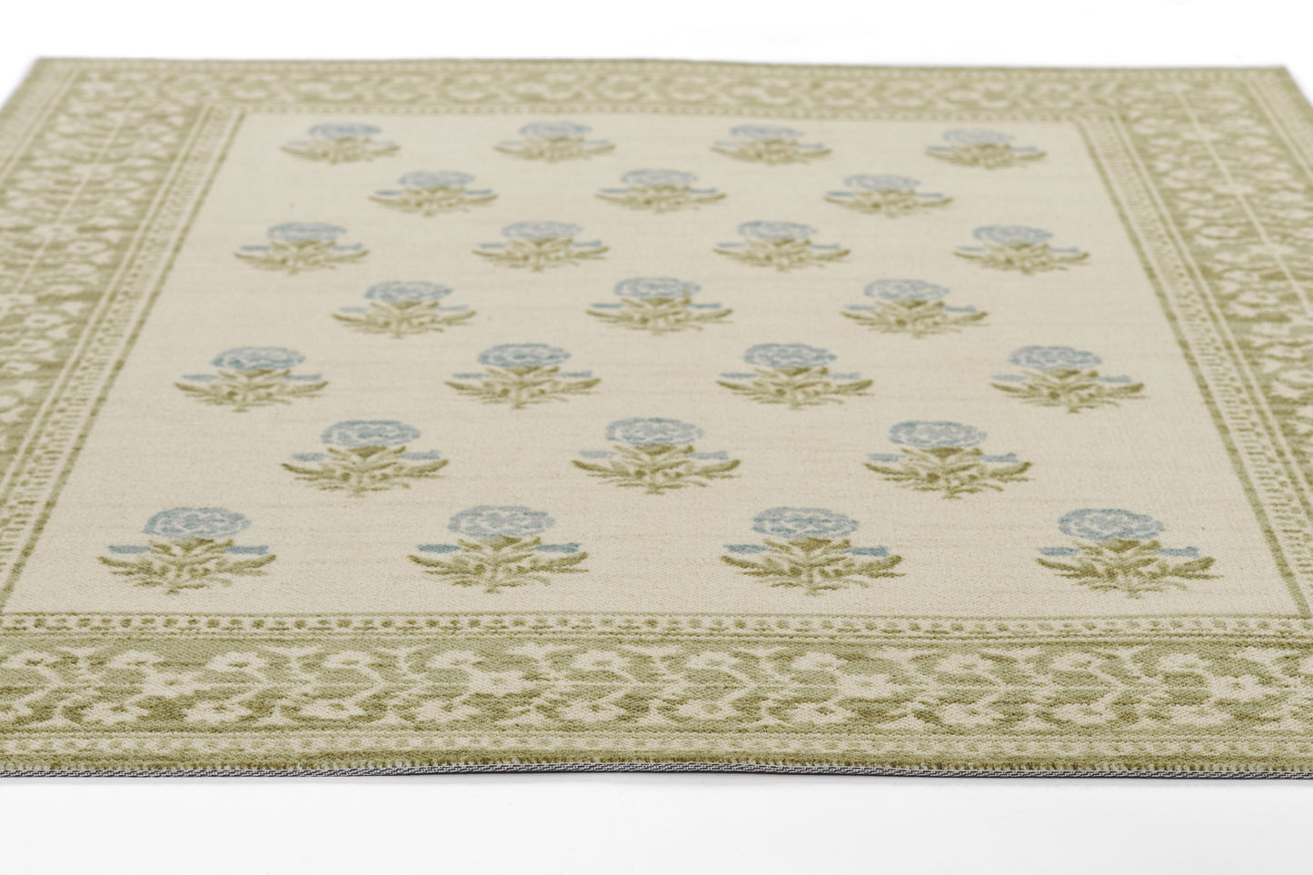 Cream rectangular area rug with blue floral rosettes and an olive-green ornate border.