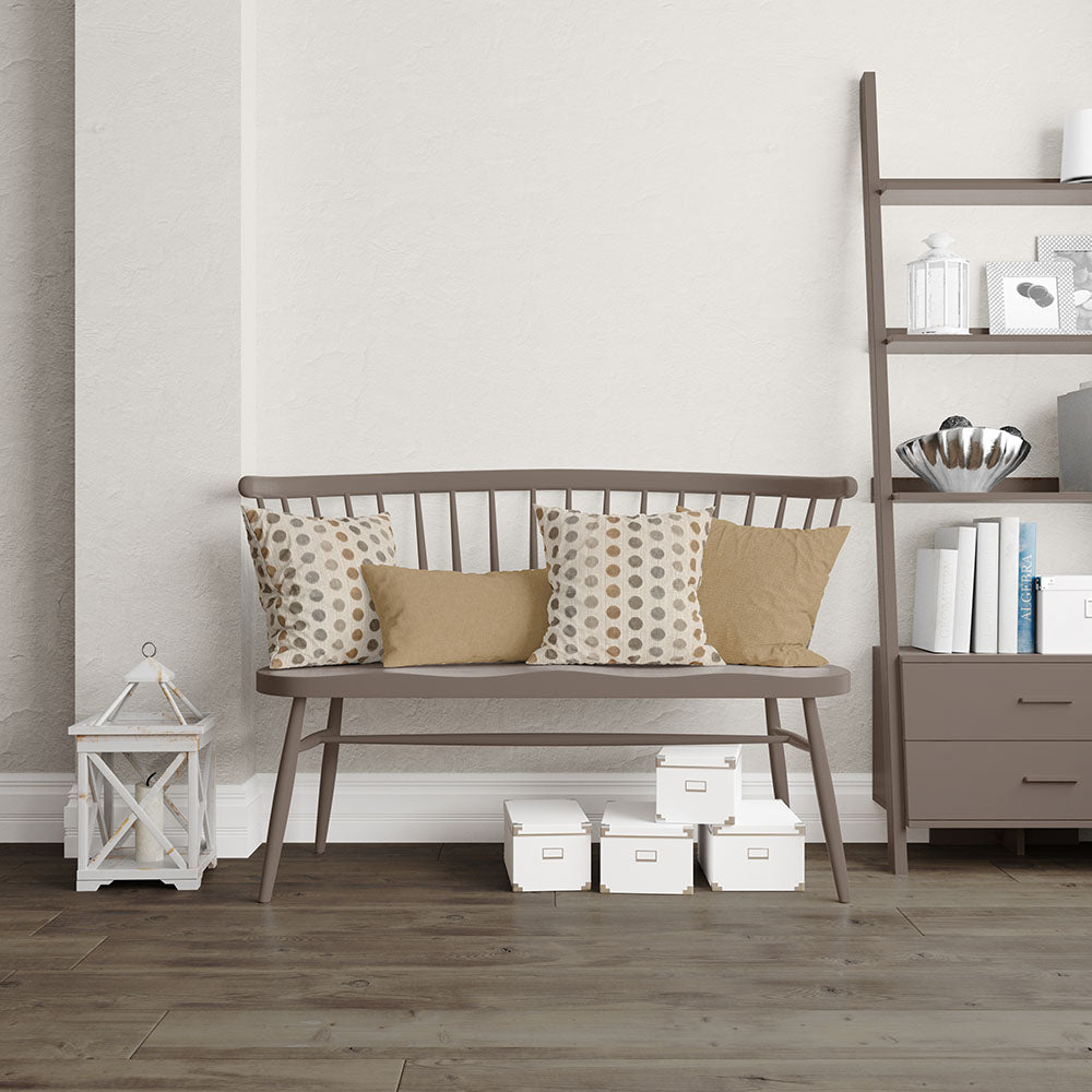 Desert solid fabric sample in cream and brown tones; lifestyle scene features a brown wooden bench with a slatted back and slim legs, cream and mustard cushions, plus a lantern and a shelf with storage boxes nearby.