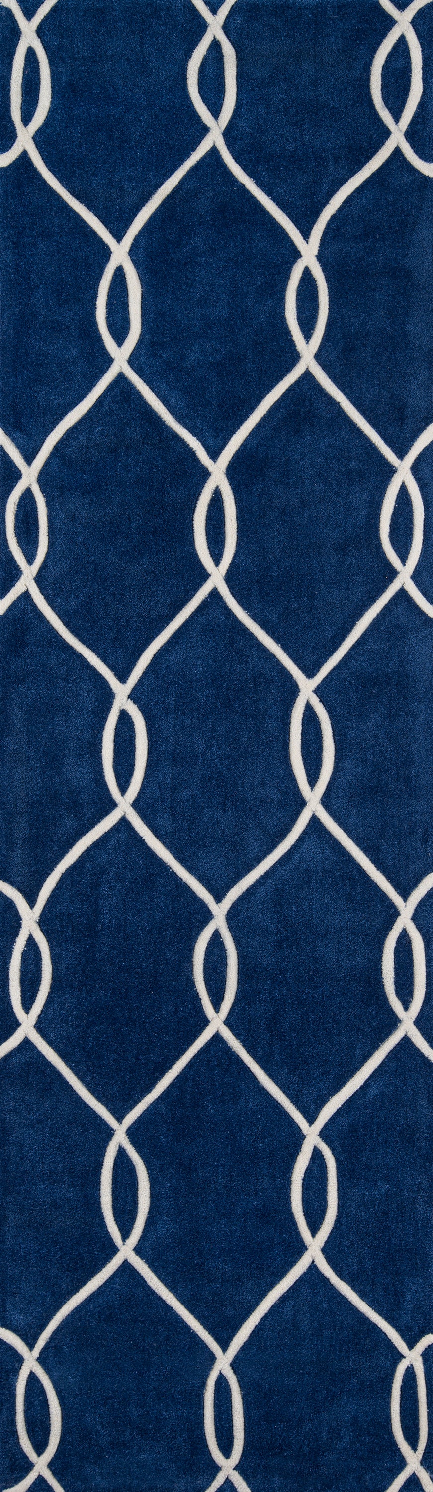 Navy blue rug with white interlocking lattice pattern; plush, modern geometric trellis design.