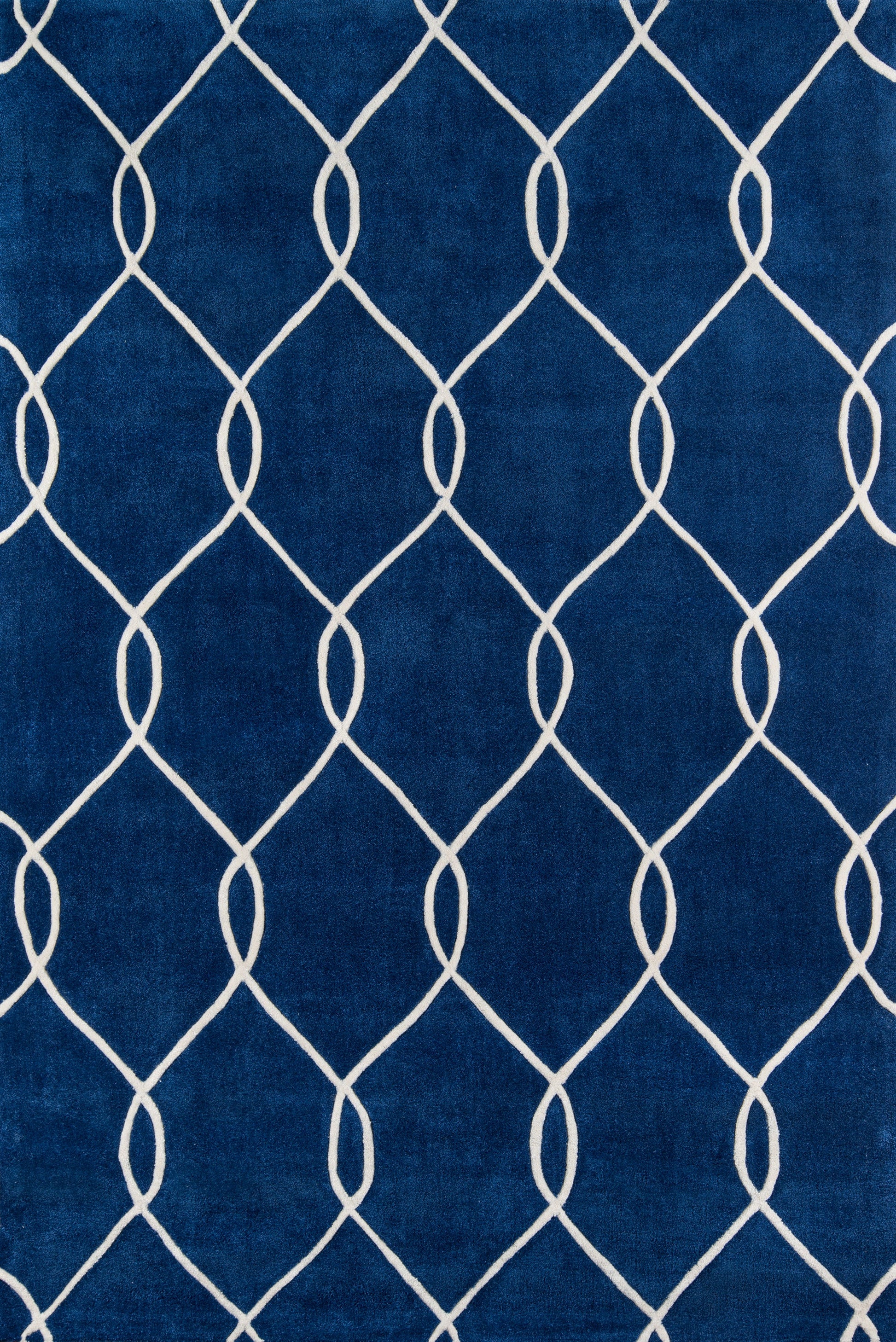 Navy blue rug with a white curved lattice pattern forming diamonds; modern geometric home decor.
