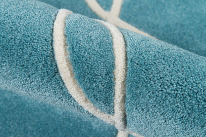 Teal blue plush rug runner with a white looped border, close-up of soft pile texture.