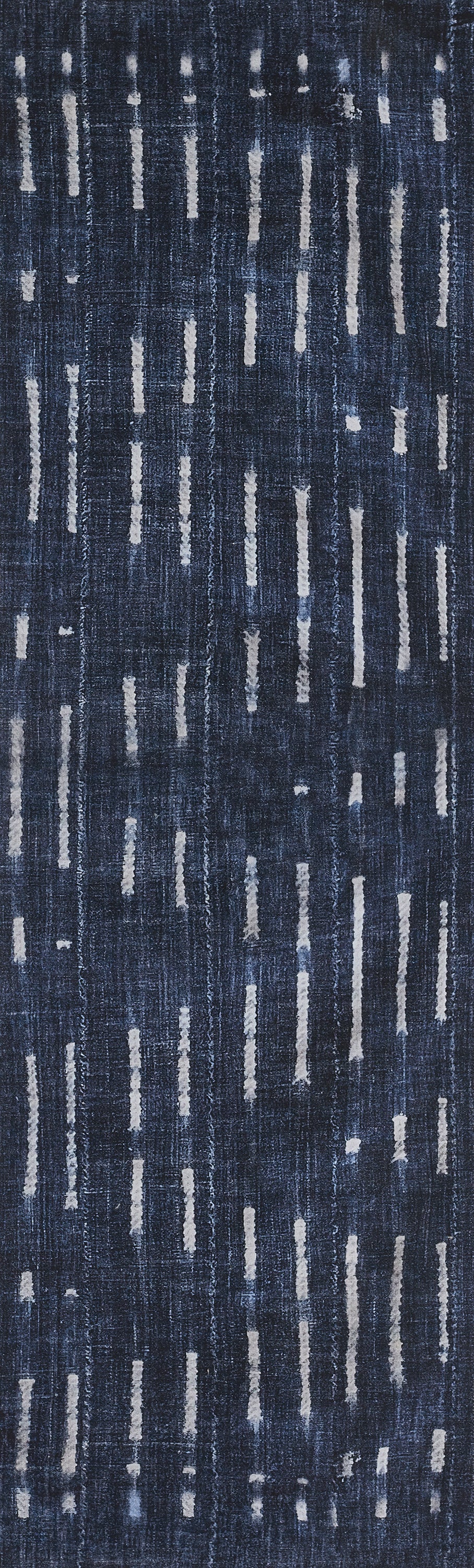 Rectangular navy blue rug with irregular light gray vertical stripe motifs; modern abstract pattern