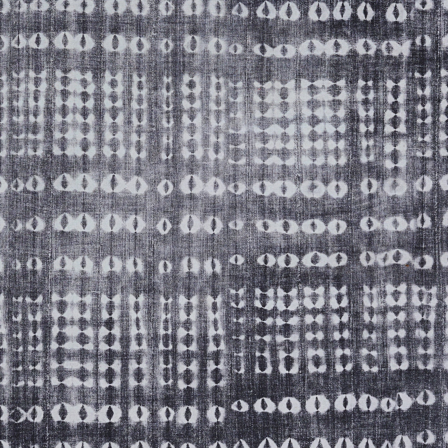 Indigo rug with a white dotted grid pattern; cotton/linen texture, boho ikat-inspired, suitable for floor decor.