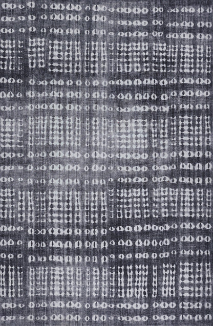 Indigo woven fabric with irregular white dot grids; batik/ikat-inspired decorative textile.
