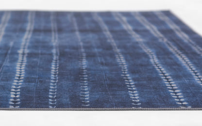 Blue woven rug with white dashed vertical stripes; rectangular floor runner for living spaces.