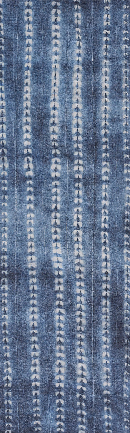 Blue denim fabric with repeating vertical white dotted stripe patterns.