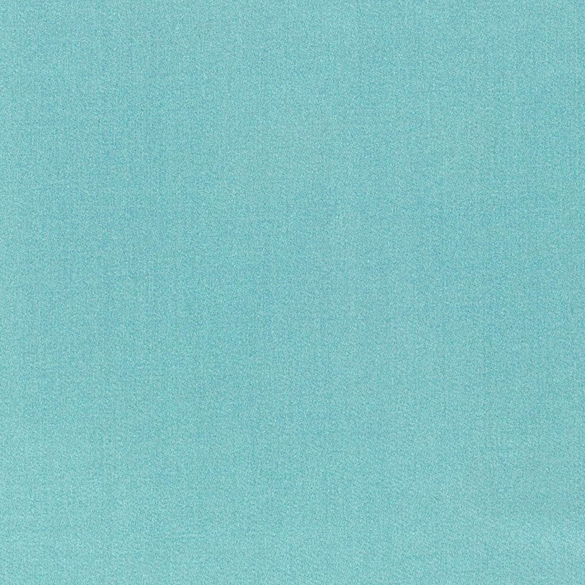 Blue textured fabric backdrop with subtle grain and soft gradient.