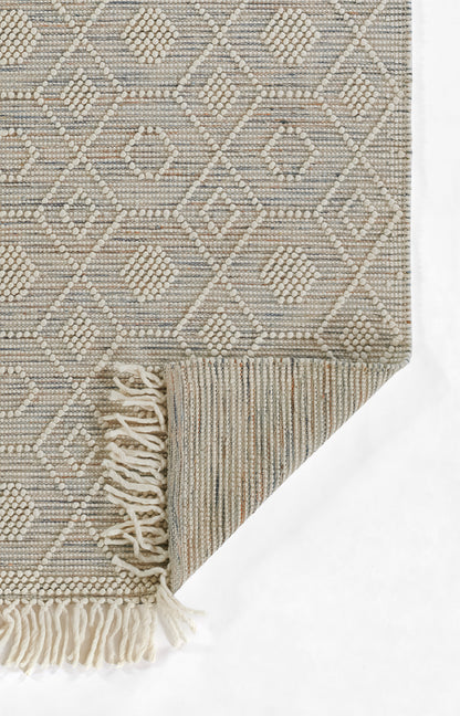 Neutral beige-gray woven runner with diamond geometric pattern, textured loop weave and fringe tassels along edge.