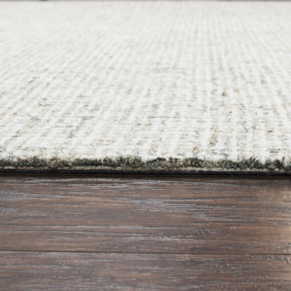 Casual rug on floor, 9' x 12', neutral tones.