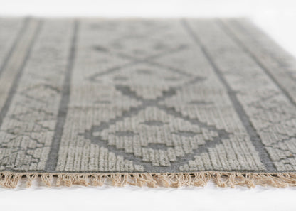 Gray geometric patterned rug with diamond motifs, woven texture and beige fringe trim, ideal for living rooms