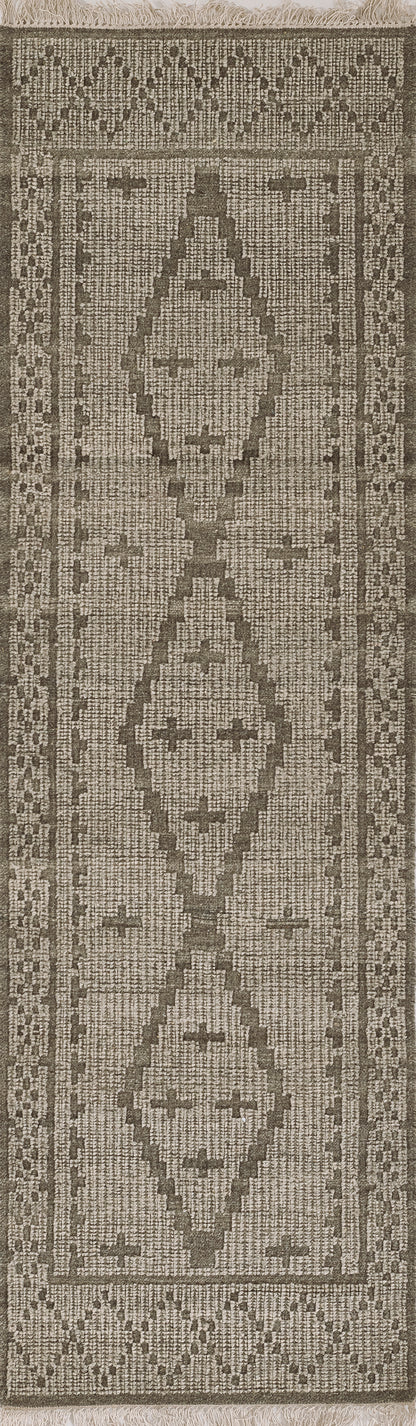 Natural beige and taupe kilim-style rug with stacked diamond medallions, geometric border, fringed ends.
