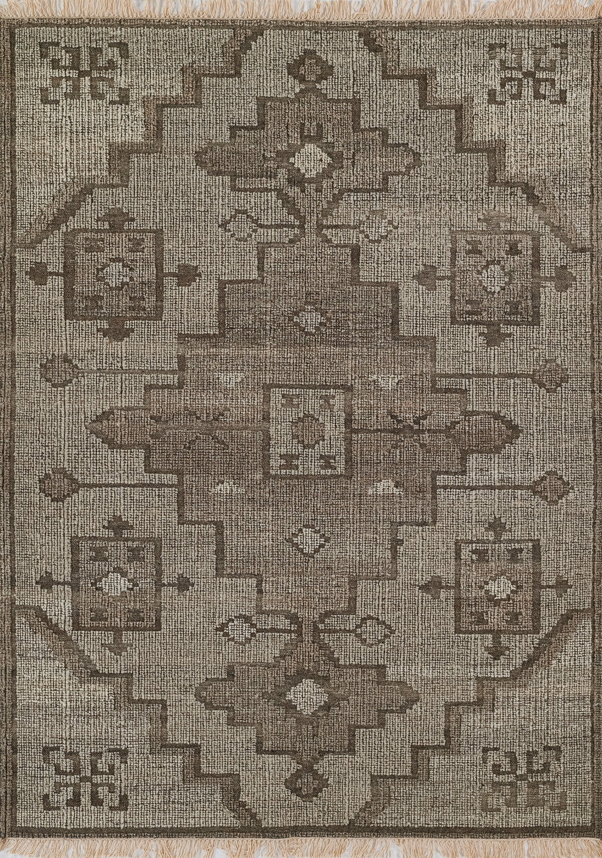 Natural brown oriental rug with a central stepped medallion, geometric borders, and fringe.