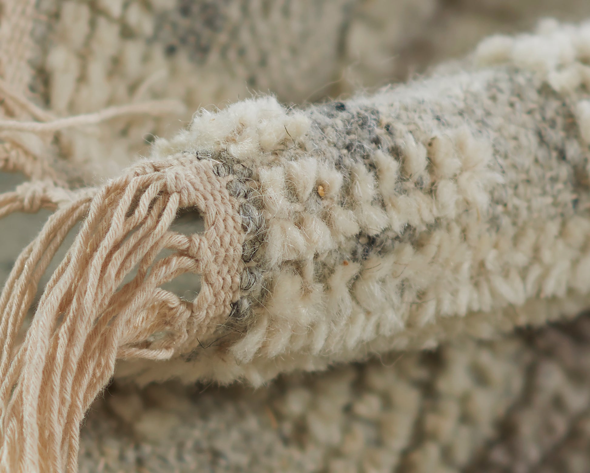 Ivory boucle rug with chunky tassel fringe, soft wool blend, boho textured runner.