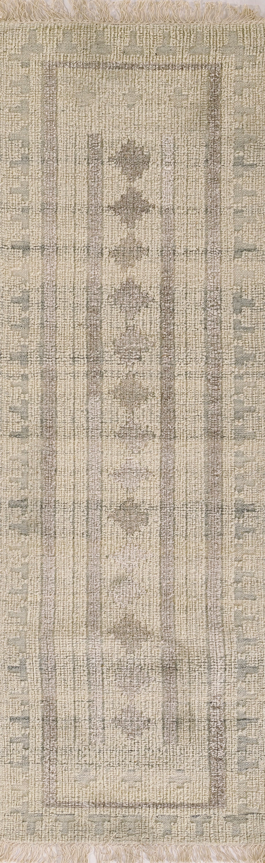 Ivory and taupe distressed oriental runner rug with geometric border, medallion pattern and fringe ends.