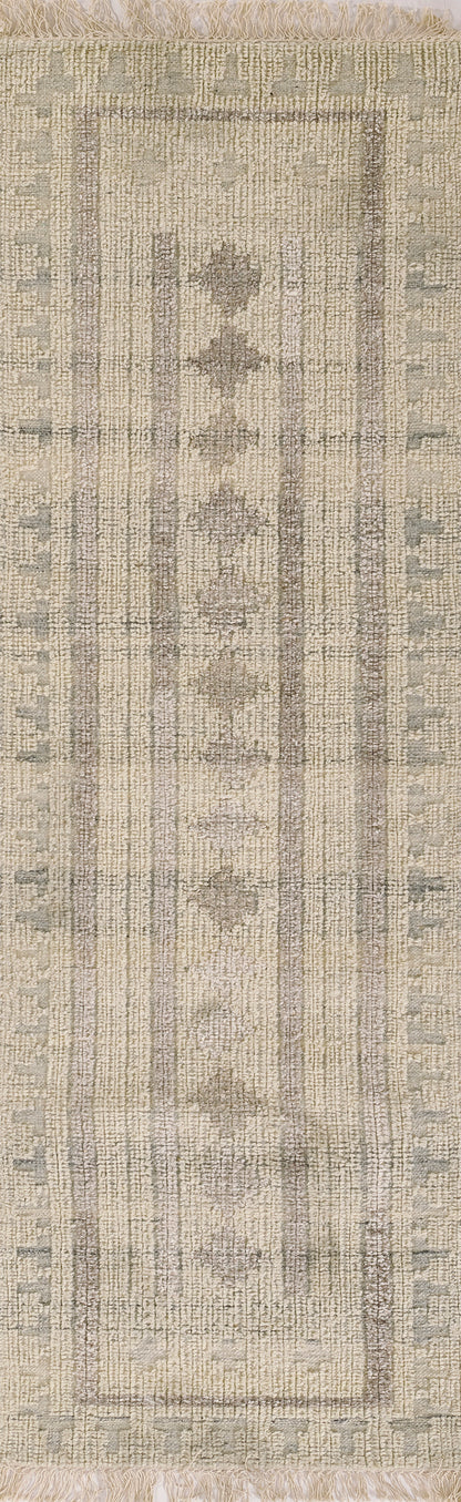 Ivory and gray-blue woven rug with central medallion motif, bordered geometric frame, fringed ends.