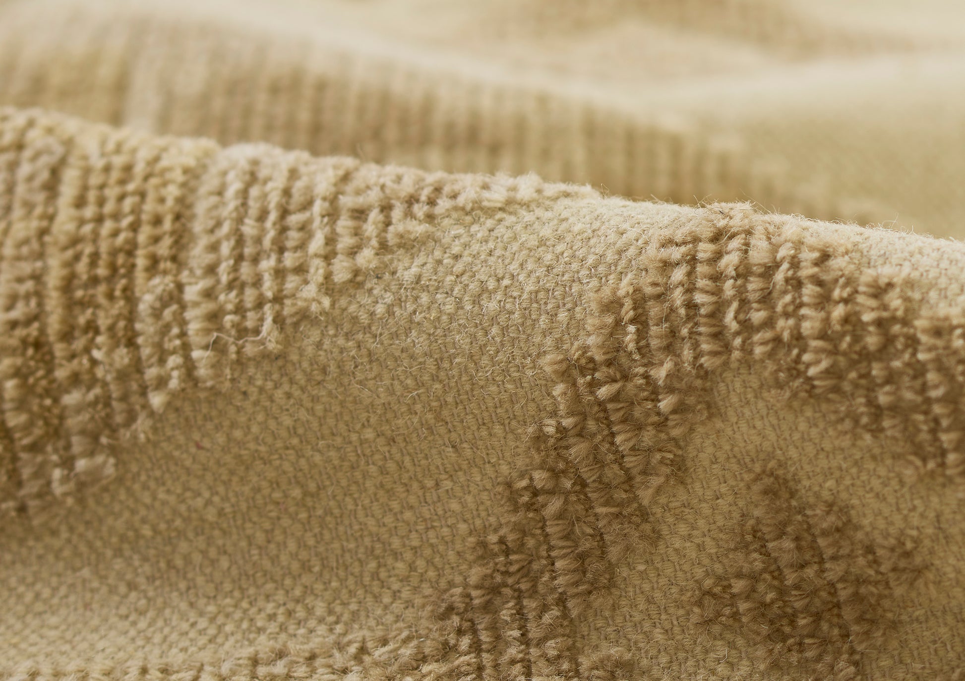 Beige terrycloth rug runner close-up with raised loop texture; soft, plush and cozy.