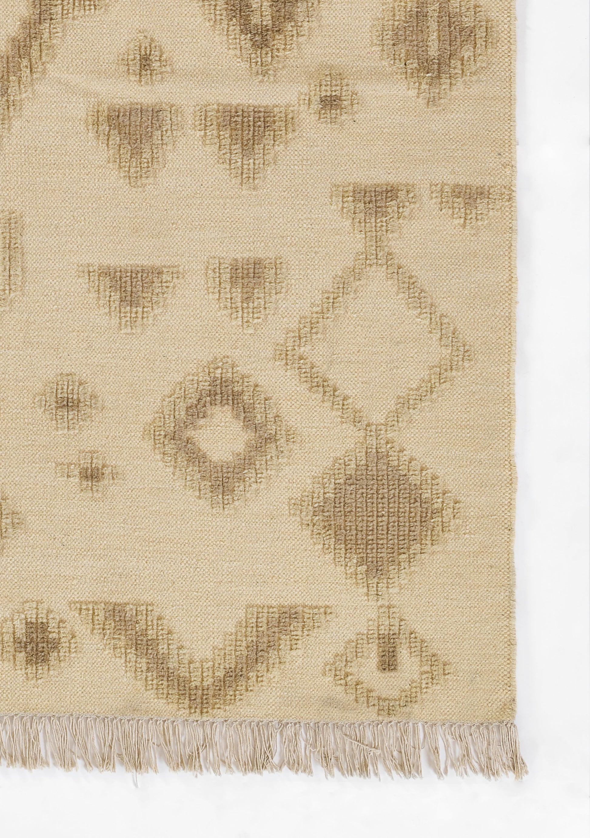 Beige woven rug with brown diamond & geometric patterns, fringed edges.