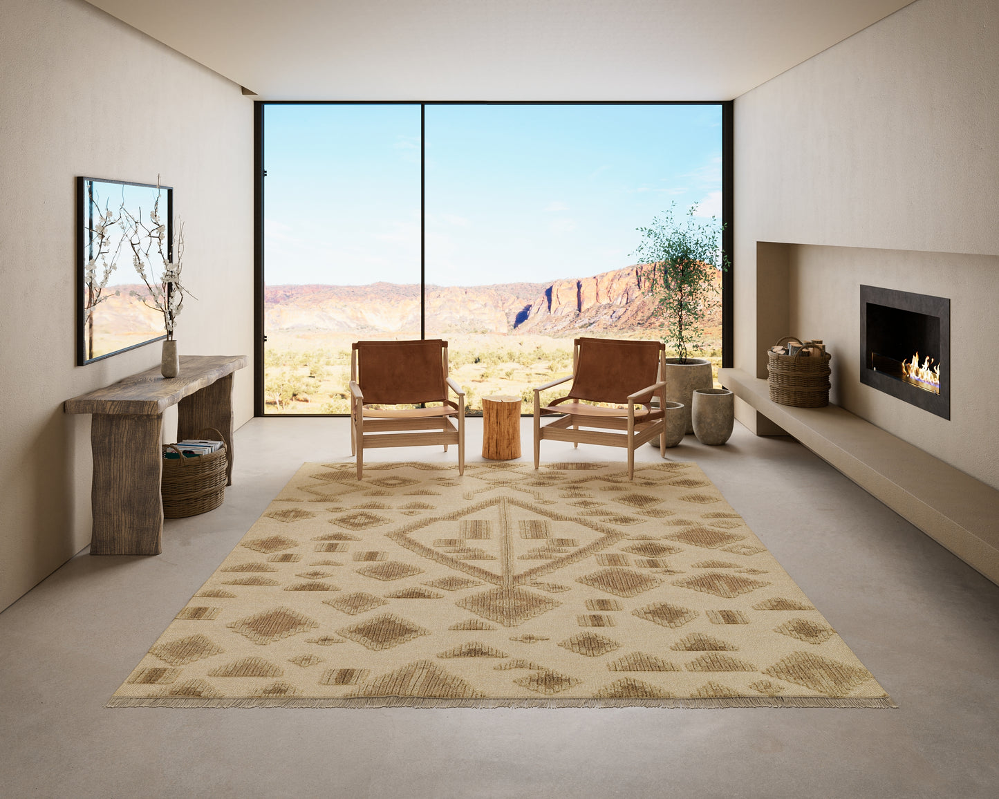 Neutral living room with beige walls, tan geometric rug, two leather armchairs, wood console, desert canyon view, fireplace.