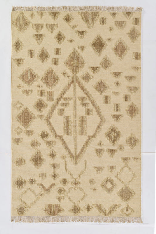 Natural beige kilim rug with taupe geometric diamonds, central diamond motif, and fringe at both ends.