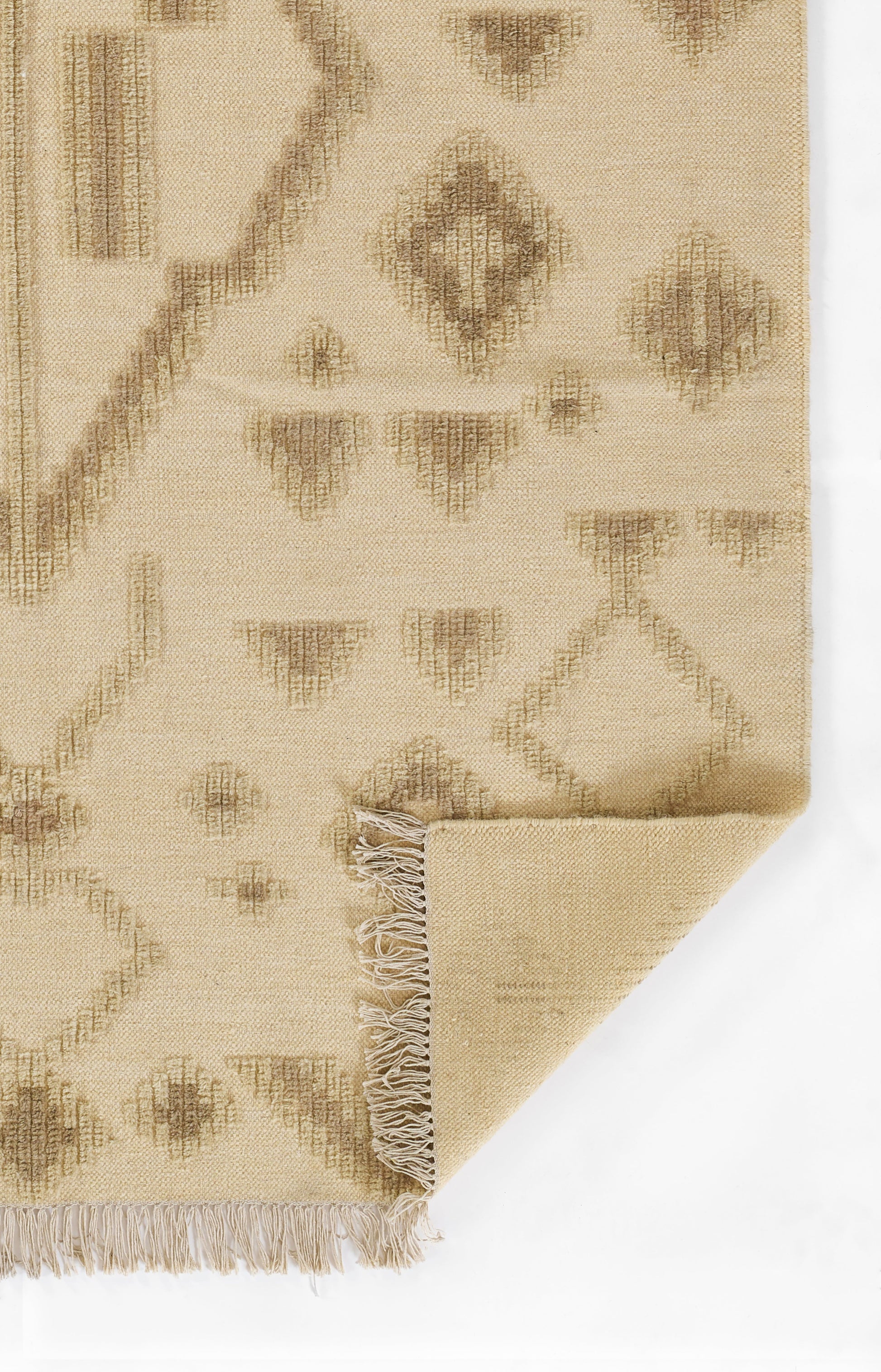 Beige flat-weave rug with taupe diamond motifs and fringe on the edge; natural jute-like texture.