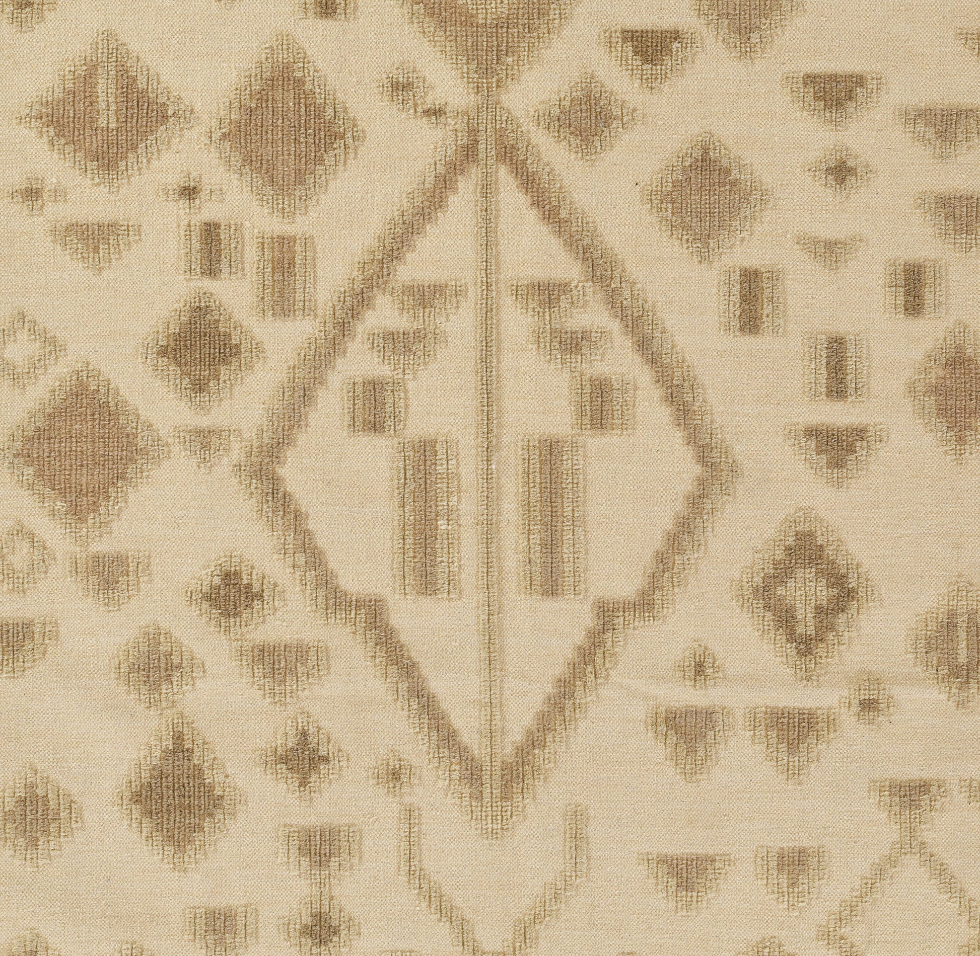 Beige woven rug with tan diamond motifs and geometric lines in a kilim-inspired pattern.