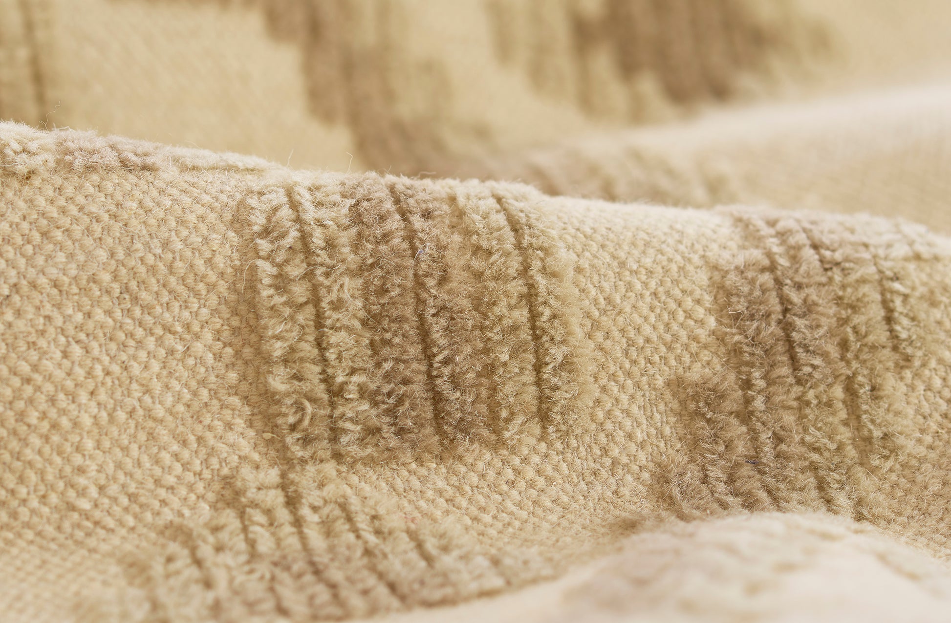 Natural beige rug runner with thick loop pile texture; ideal for hallways or entryways.