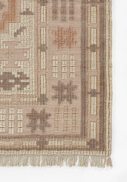 Beige-brown oriental-style rug with geometric motifs, dense woven pile, and fringed border.