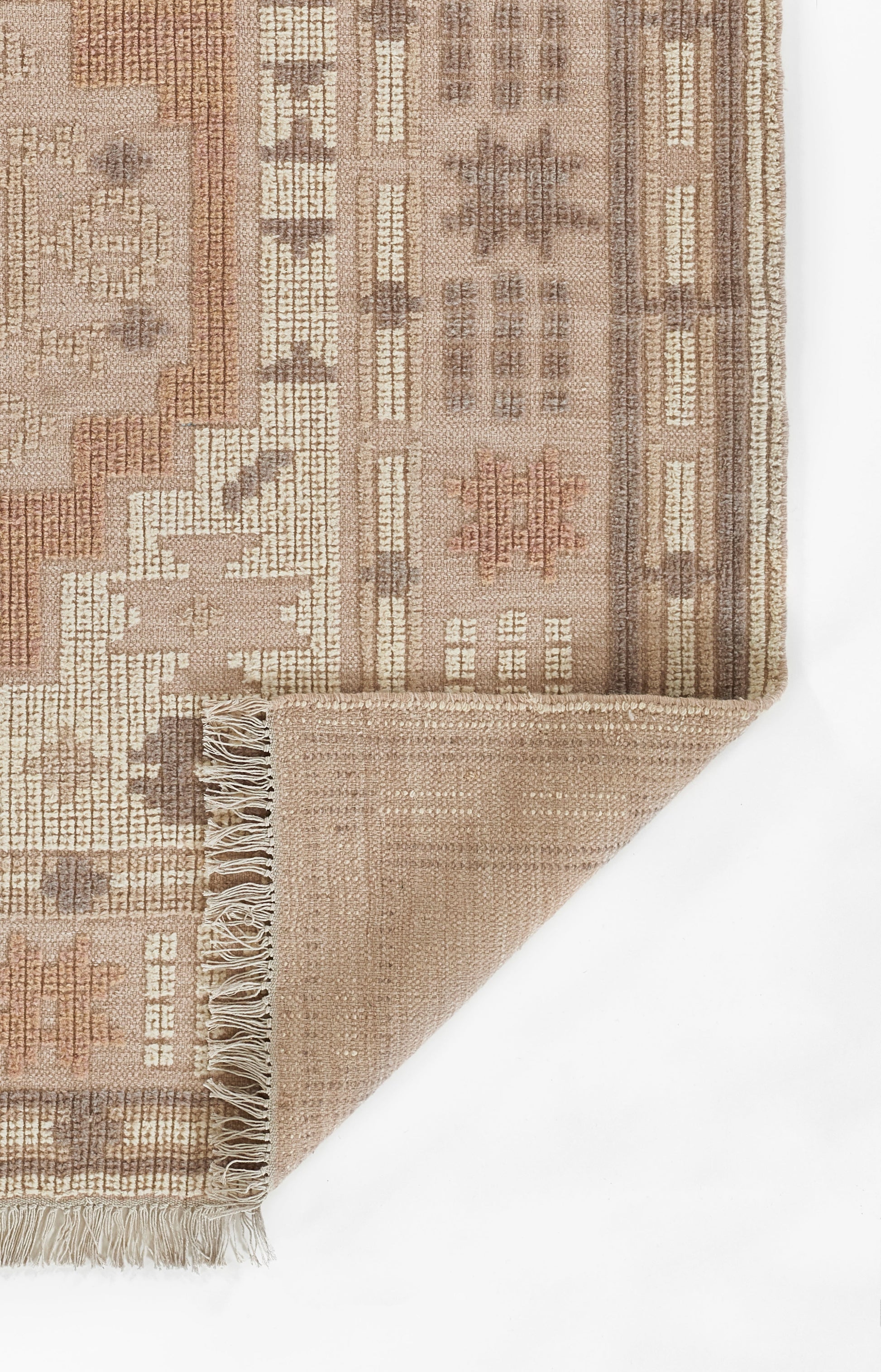Beige-brown woven rug with geometric motifs and fringed edge.