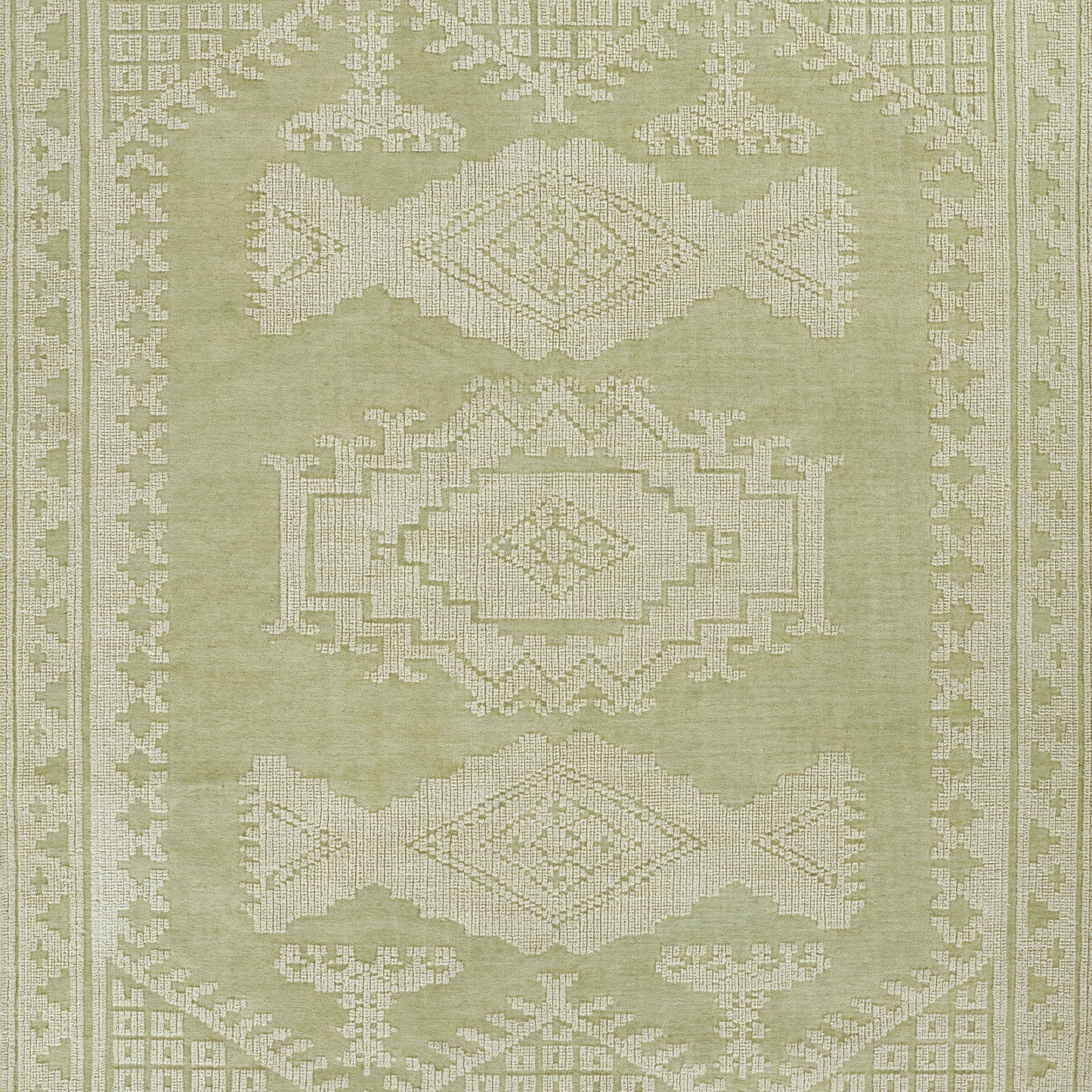 Olive green area rug with white geometric medallions and border; traditional oriental design.