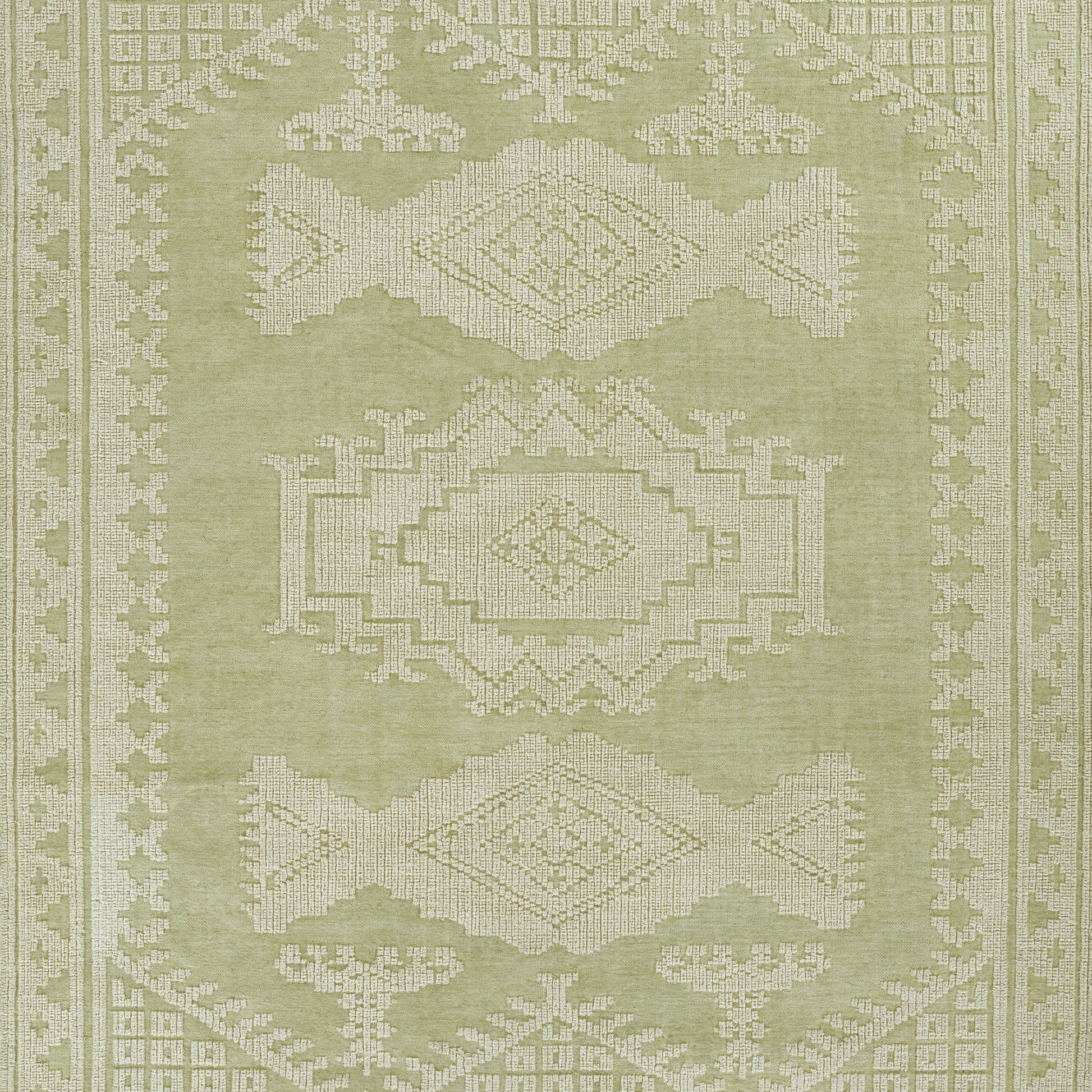 Olive green area rug with white geometric medallions and border; traditional oriental design.