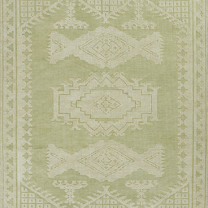 Olive green area rug with white geometric medallions and border; traditional oriental design.