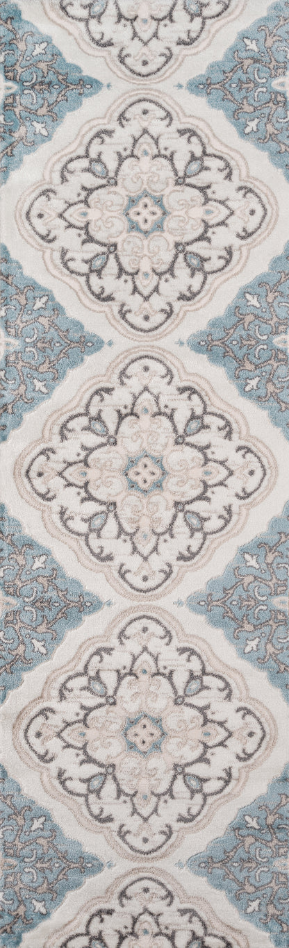 Ivory rug with blue damask medallion motifs and teal accents; ornate scrolling floral pattern.