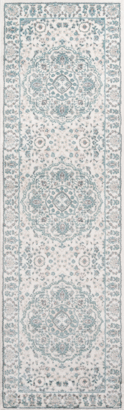 Ivory rug with teal-blue Persian medallions, intricate floral border and repeating motifs.