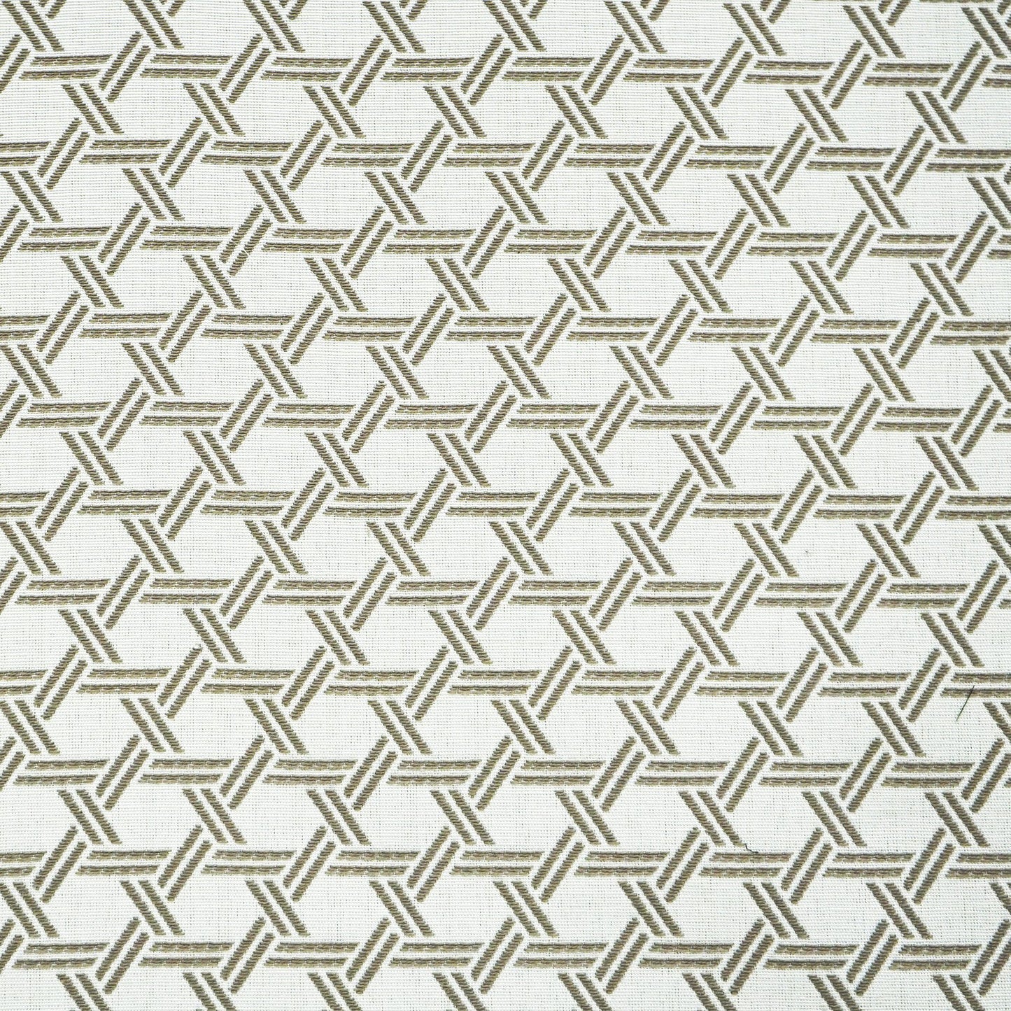 Beige fabric with a repeating brown interlocking lattice pattern of triangles forming a hex-like motif.