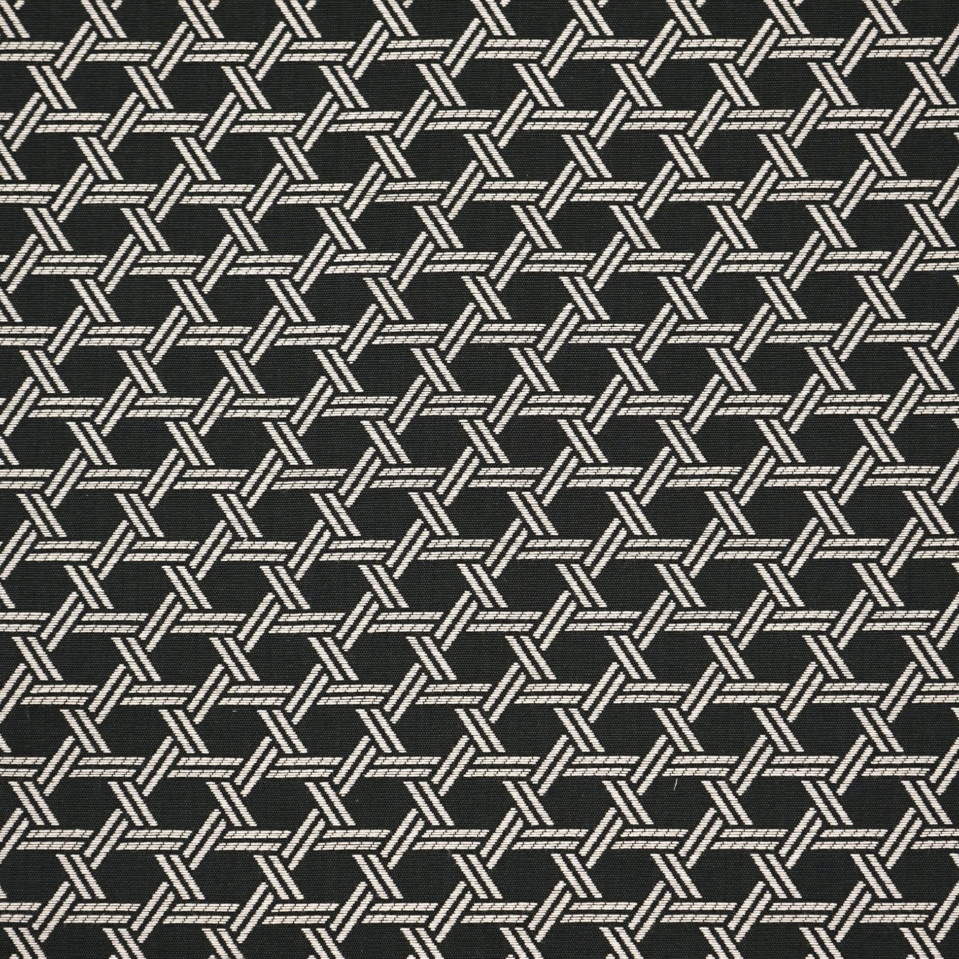 Dark fabric with an off-white interlocking diagonal weave forming hexagon-like tile motifs