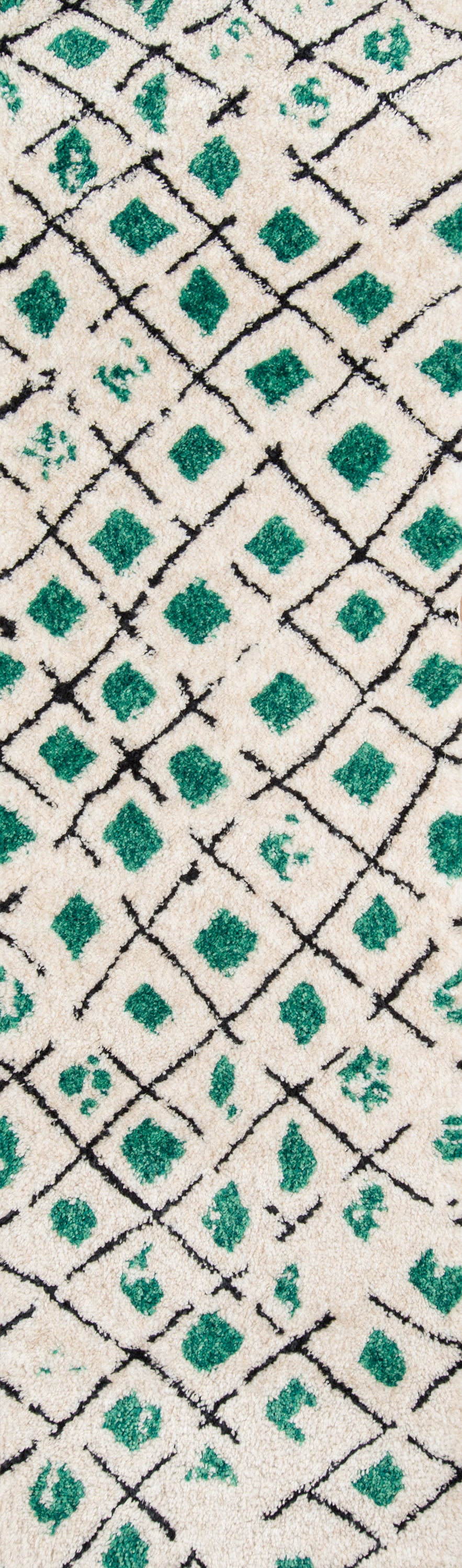 Cream shag rug with emerald green diamonds and black lattice lines; geometric Moroccan-inspired decor, 4' x 6'.