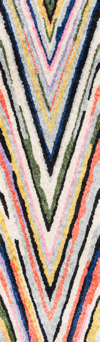 Thick shag runner with multicolor chevron V-pattern in pink, yellow, blue, green, black, white and gray.